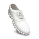 White rexine school shoe lace-up on desk for boys, casual footwear accessory